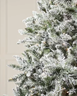 Pre-Lit Full Bodied Snow Flocked Christmas Tree, 7 Ft